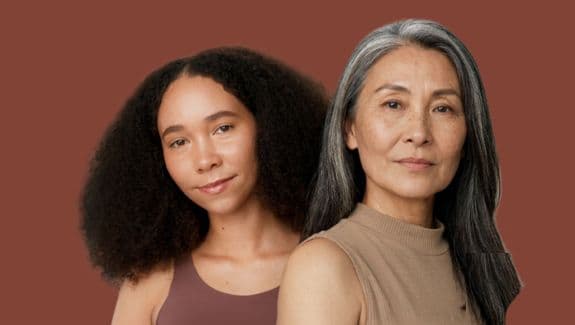 two women look confidently at the camera