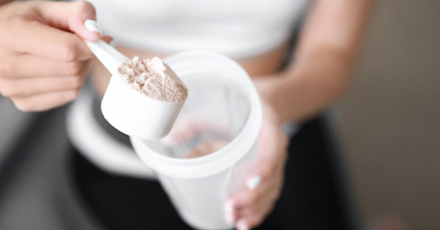 Sporty young woman with collagen at home, closeup